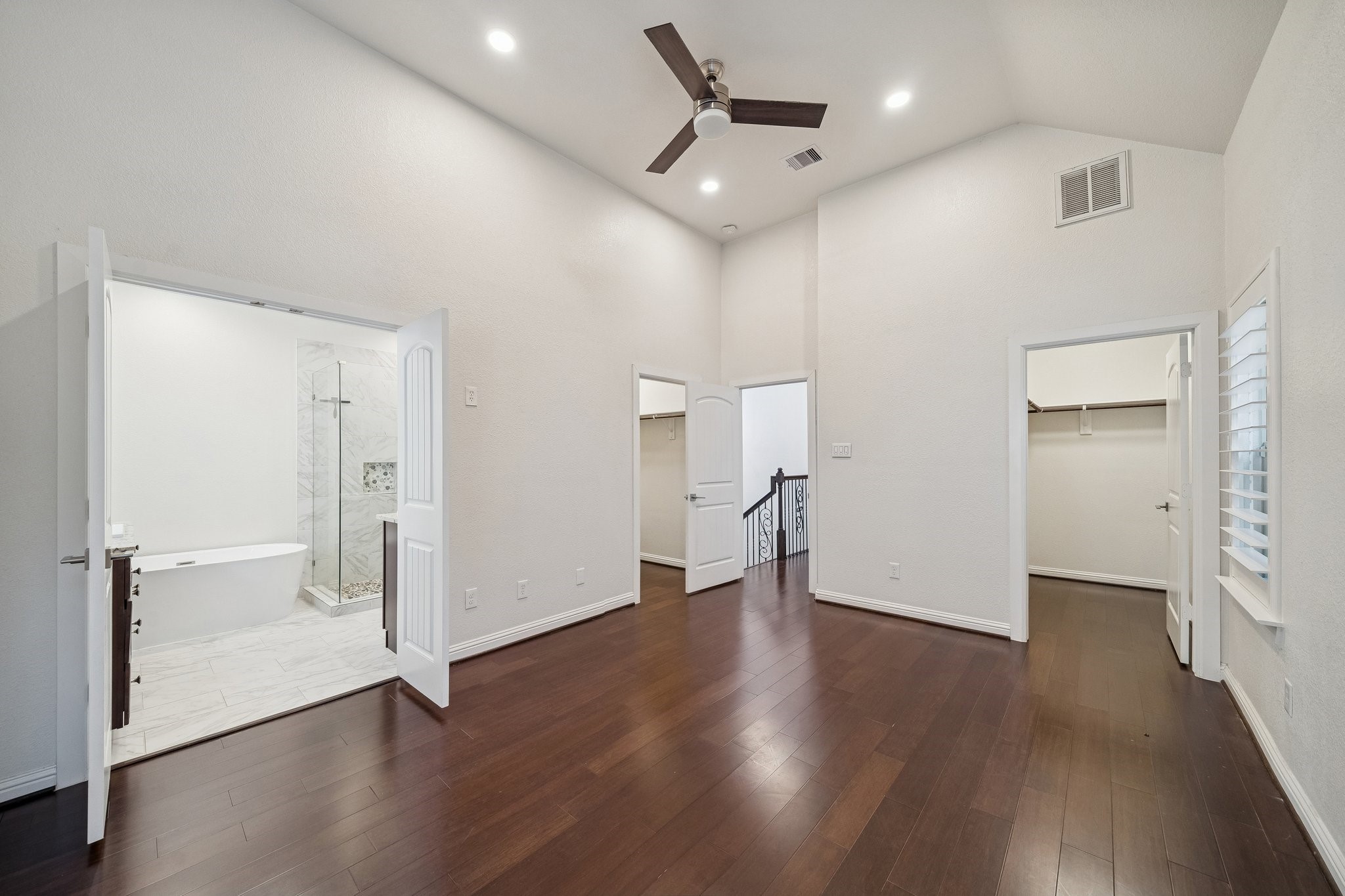 2741 Sherwin Street Houston, TX 77007 - Photo 10 of 21 an empty room with wooden floor and a hallway