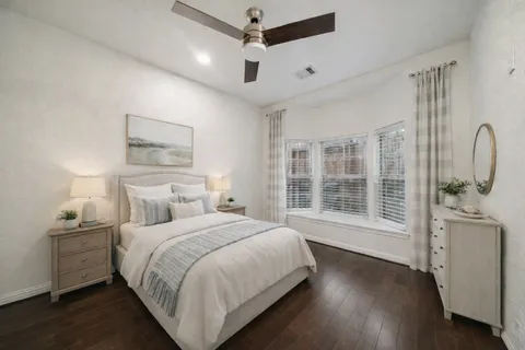 a view of entryway with furniture and wooden floor