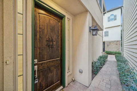 a view of a house with backyard and glass door