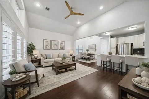 a view of kitchen with stainless steel appliances refrigerator oven and cabinets
