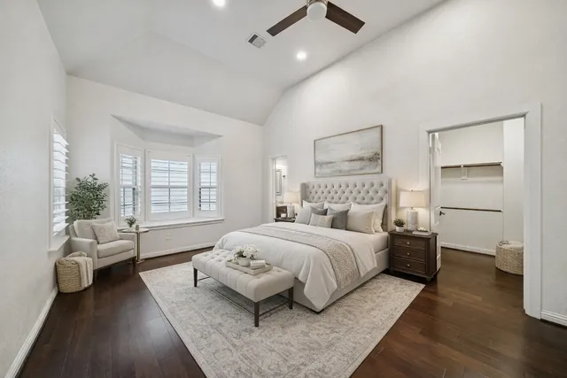 a kitchen with a refrigerator a microwave a sink and cabinets
