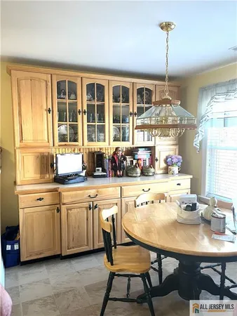 a very nice looking dining room with a table and chairs