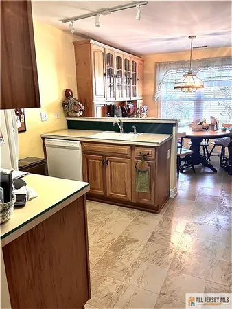a kitchen with a sink and a stove