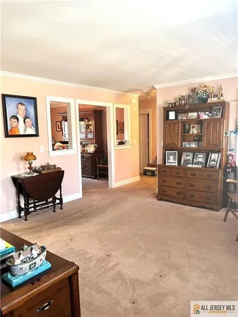 a living room with furniture a couch and a window