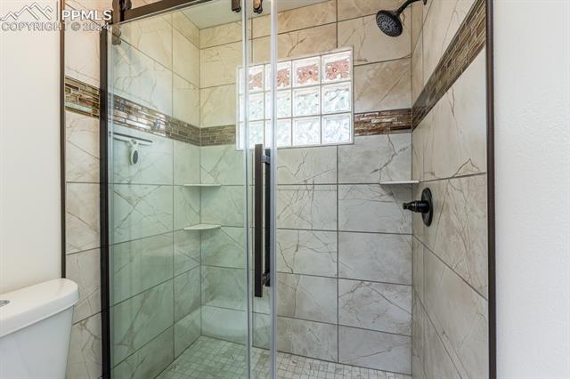 475 Cimarron Road Monument, CO 80132 - Photo 16 of 34 Brand New Primary Bathroom- Walk-in Shower!