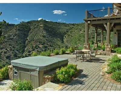 310 Little Andorra Road Edwards, CO 81632 - Photo 3 of 7 a view of a patio with table and chairs and potted plants