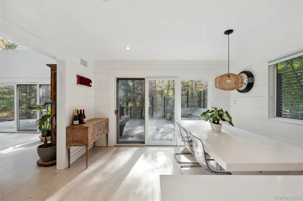 a room with wooden floor and furniture