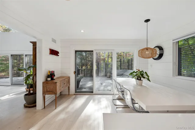 a room with wooden floor and furniture