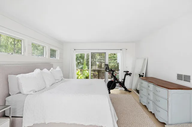 a bed room with a bed and a window