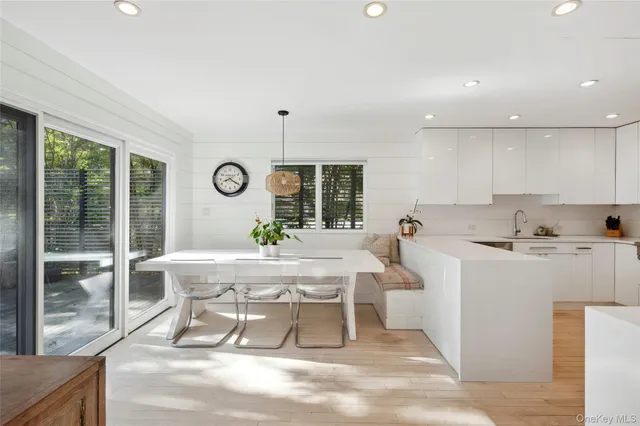 a living room with furniture a window and appliances