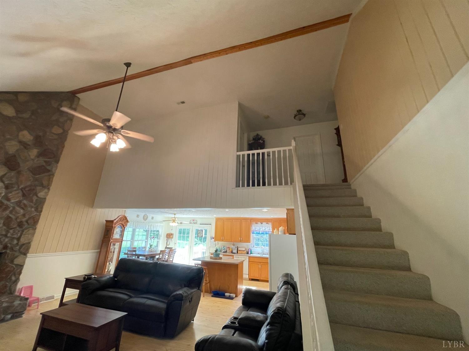 755 Bearfield Road Amherst, VA 24521 - Photo 31 of 98 a living room with furniture and stairs