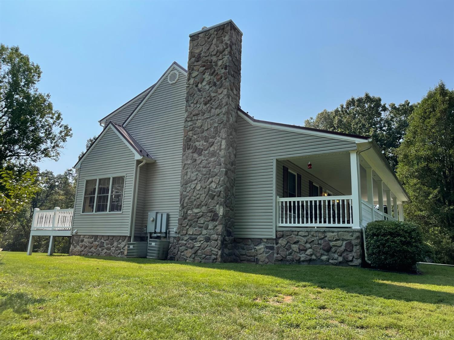 755 Bearfield Road Amherst, VA 24521 - Photo 7 of 98 a view of a house with a yard and a garden