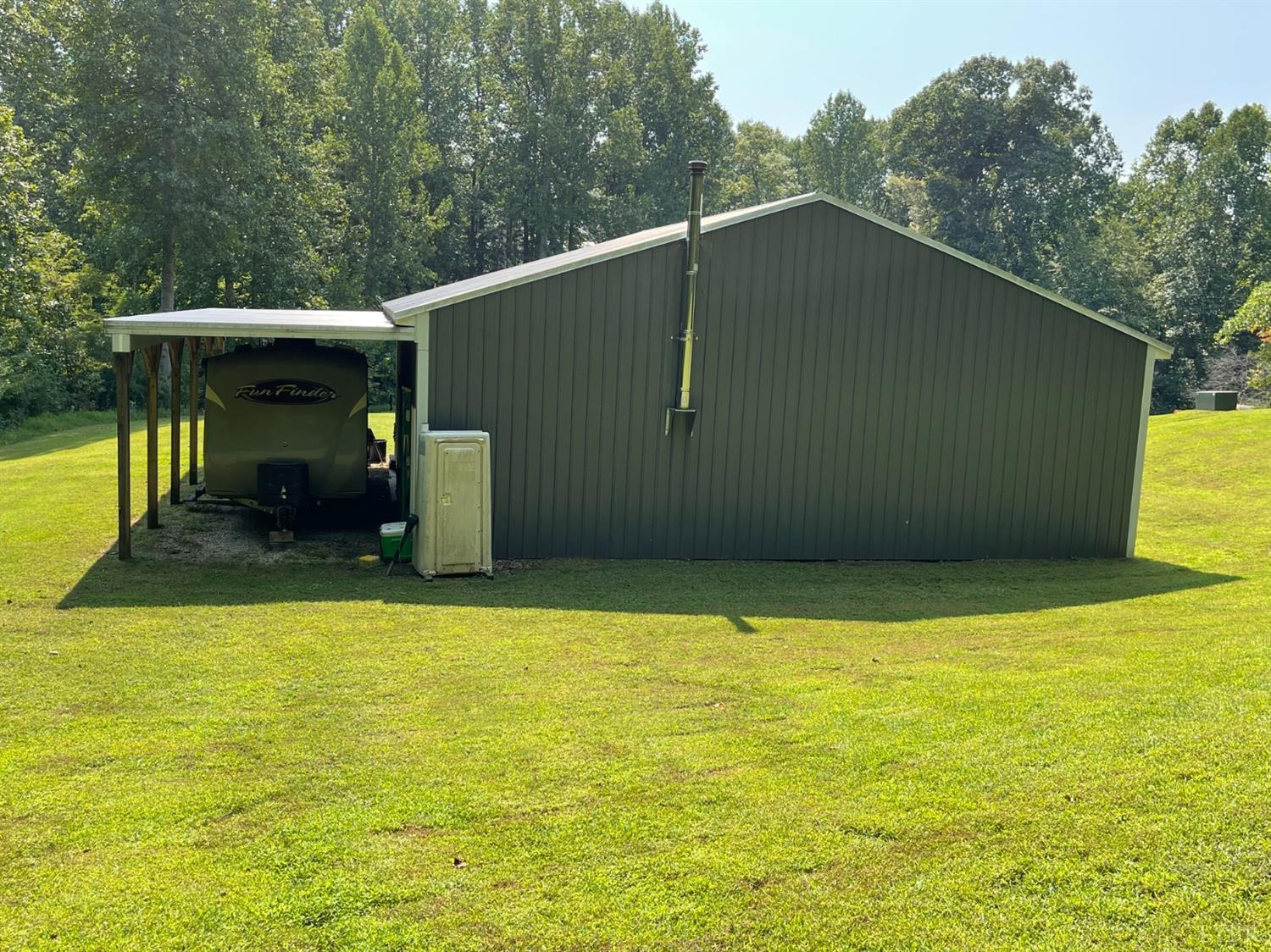 755 Bearfield Road Amherst, VA 24521 - Photo 85 of 98 a backyard of a house with lawn chairs and wooden fence