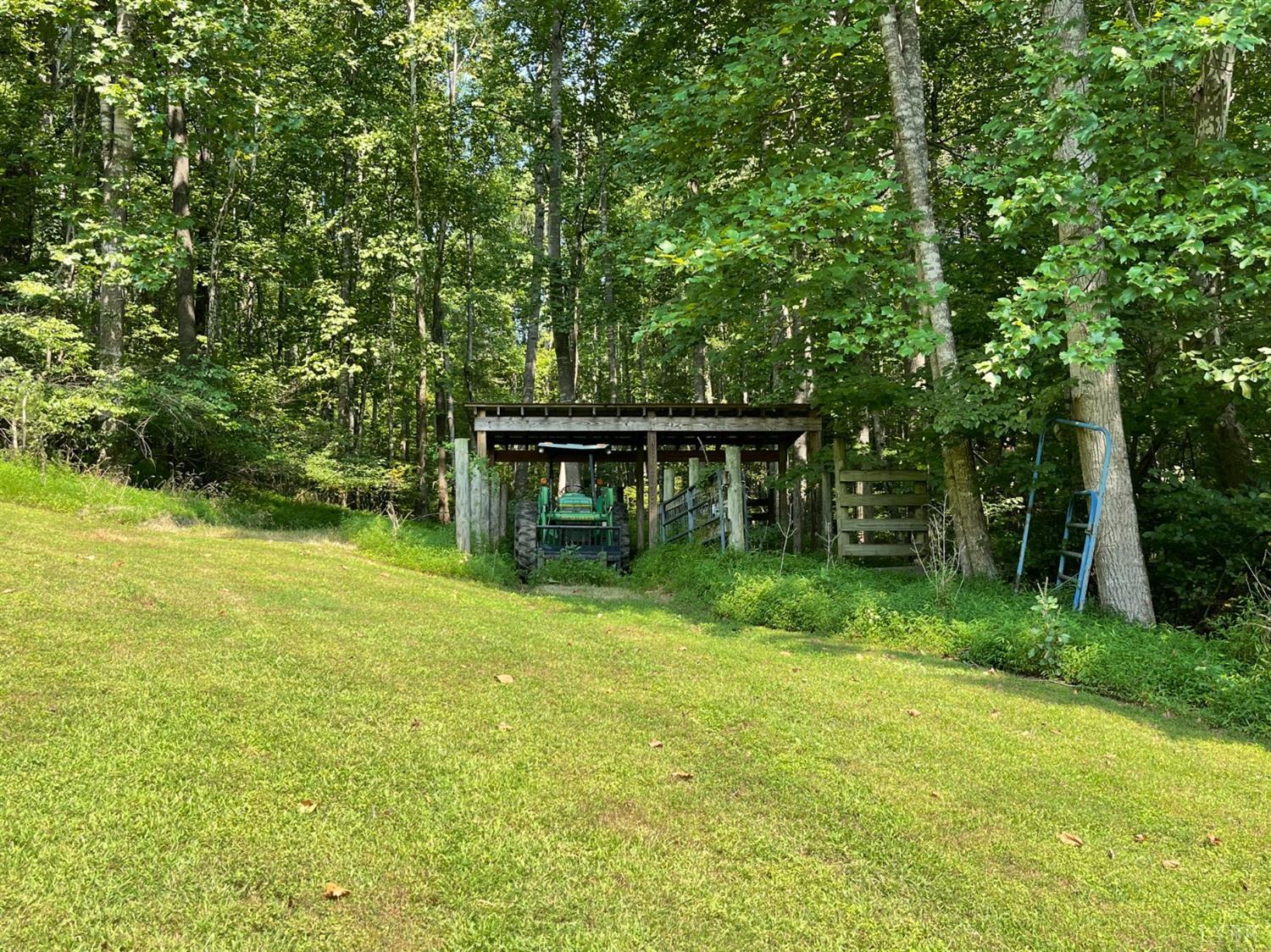 755 Bearfield Road Amherst, VA 24521 - Photo 86 of 98 a view of backyard with table and chairs and potted plants