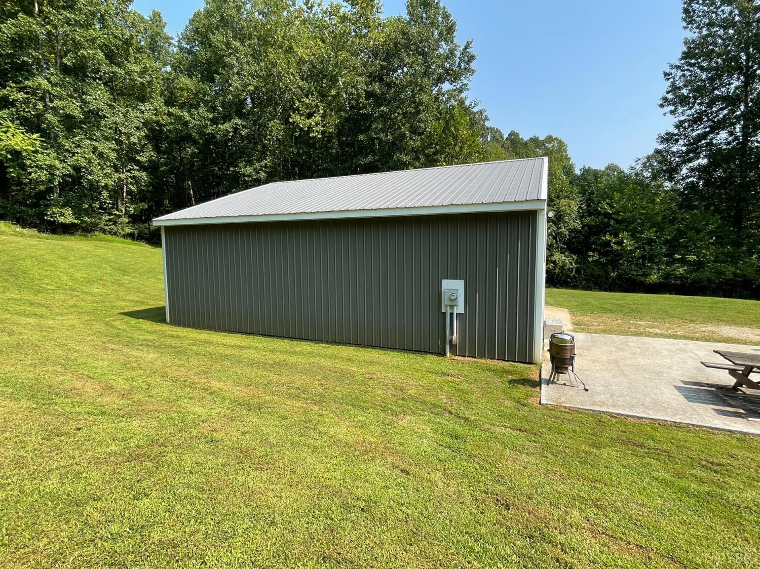755 Bearfield Road Amherst, VA 24521 - Photo 88 of 98 a house with huge green field in front of it
