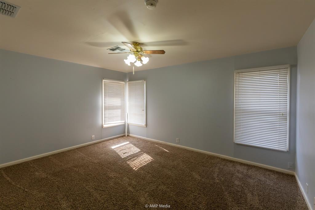 451 Northwest Ave F Hamlin, TX 79520 - Photo 18 of 29 a view of empty room with windows
