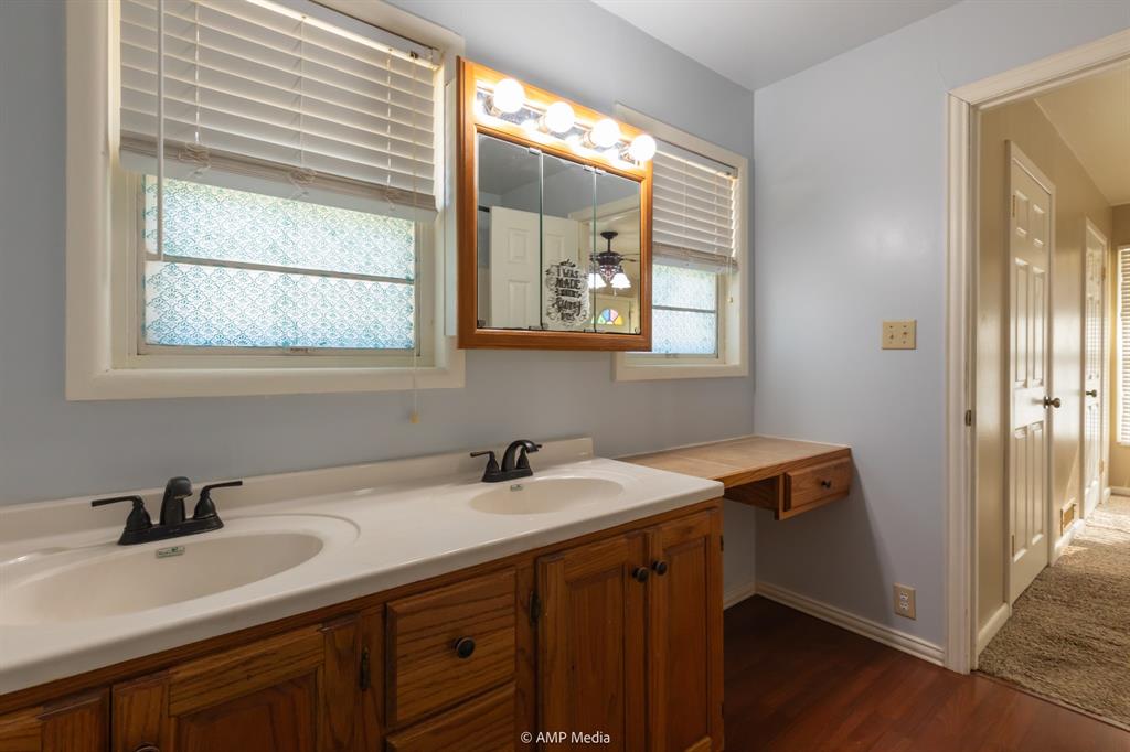 451 Northwest Ave F Hamlin, TX 79520 - Photo 19 of 29 a bathroom with a sink and a window