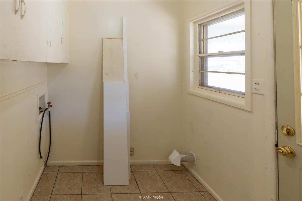 451 Northwest Ave F Hamlin, TX 79520 - Photo 25 of 29 a bathroom with a granite countertop shower and a toilet