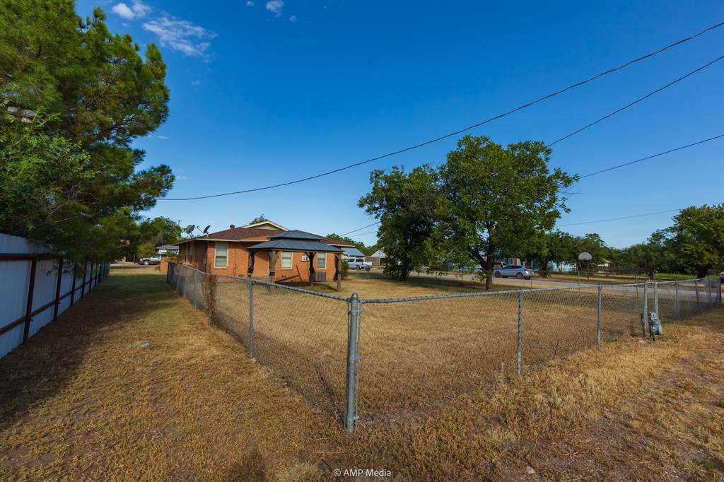 451 Northwest Ave F Hamlin, TX 79520 - Photo 26 of 29 a view of a house with a yard