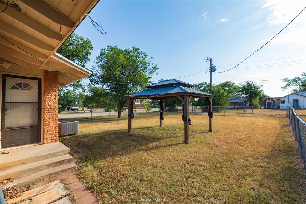 451 Northwest Ave F Hamlin, TX 79520 - Photo 28 of 29 a view of a street with potted plants