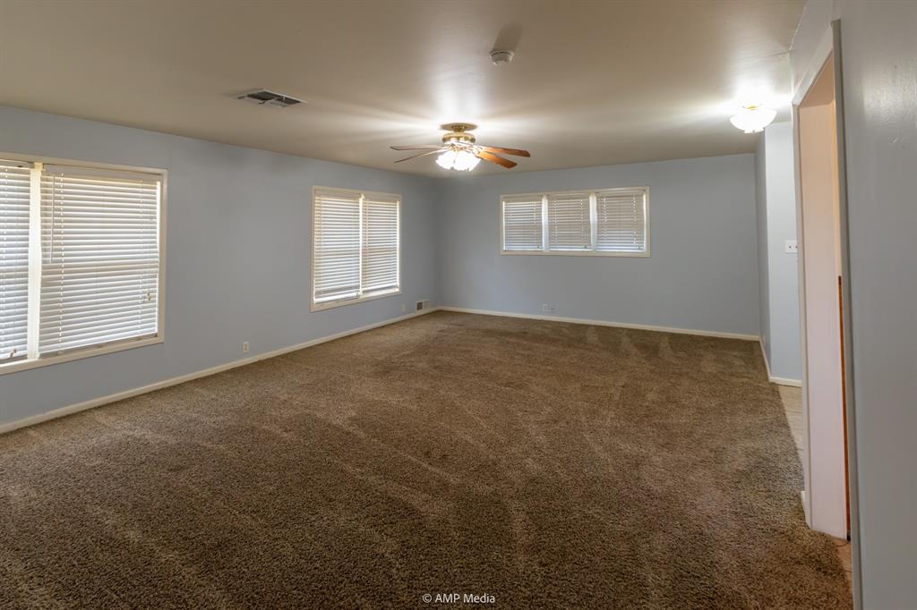 451 Northwest Ave F Hamlin, TX 79520 - Photo 7 of 29 a view of an empty room with a window