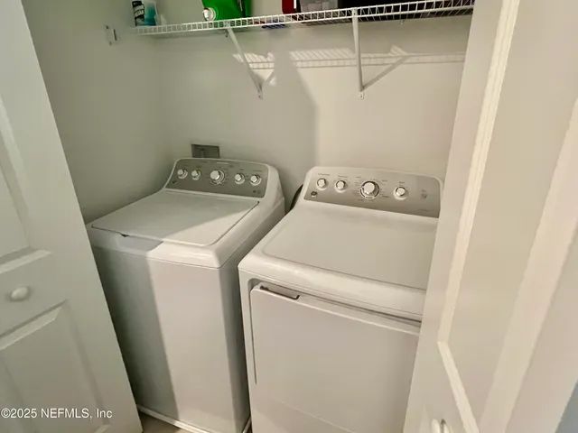 a view of a house with swimming pool and sitting area
