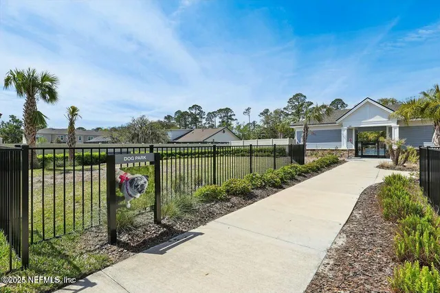 an aerial view of a house with outdoor space