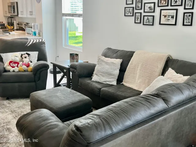 a living room with furniture and a couch