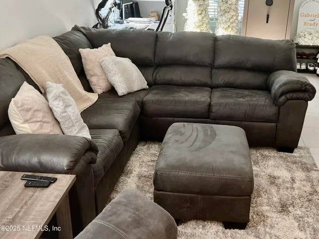 a living room with furniture and a couch