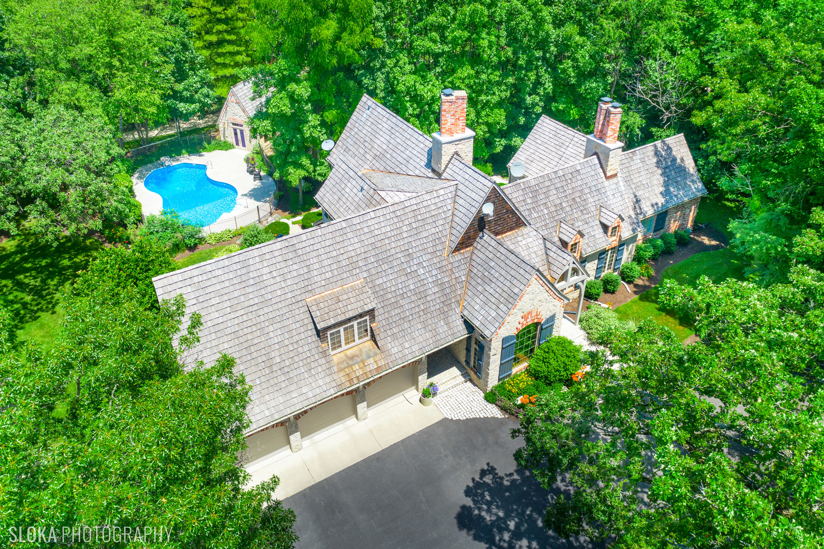 7812 East Tryon Grove Road Richmond, IL 60071 - Photo 48 of 55 an aerial view of a house with a yard and trees