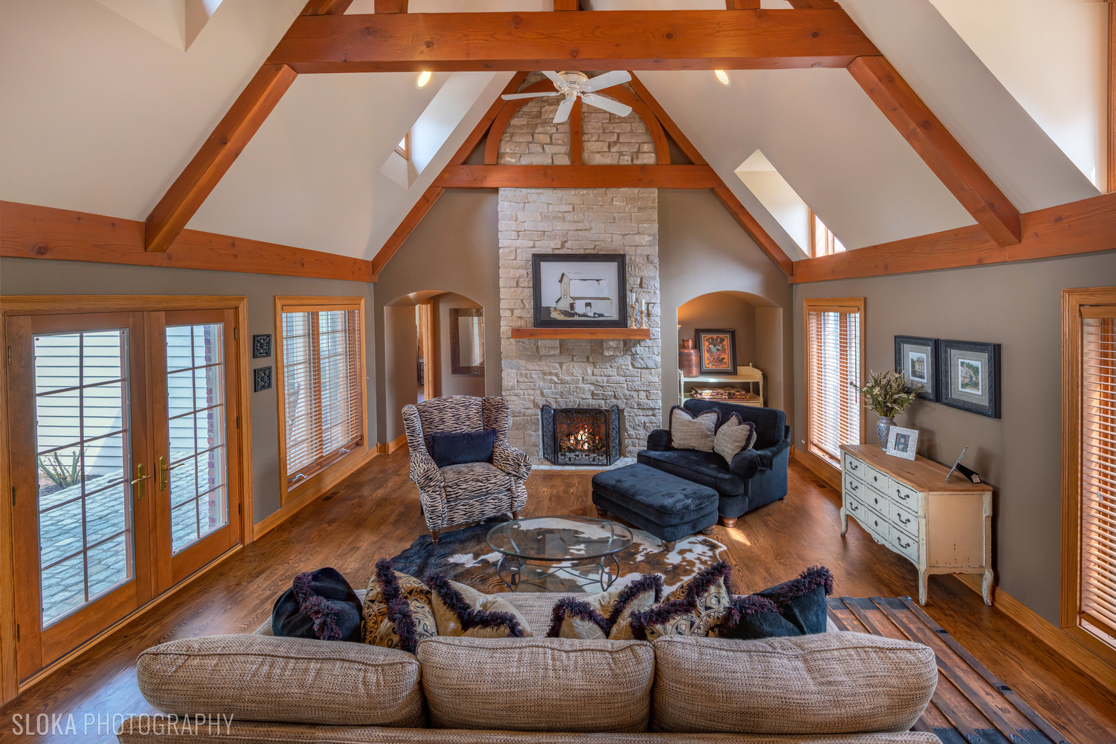 7812 East Tryon Grove Road Richmond, IL 60071 - Photo 7 of 55 a living room with furniture a fireplace and a floor to ceiling window