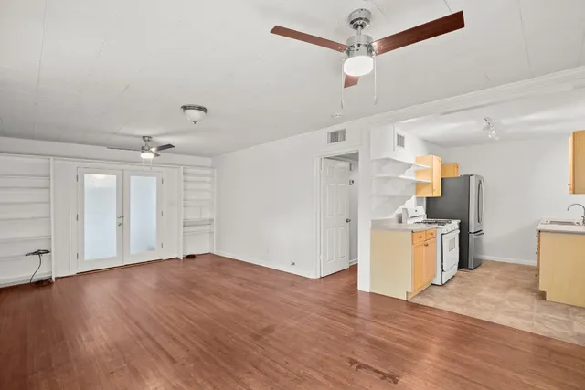 a kitchen with stainless steel appliances a refrigerator sink and stove
