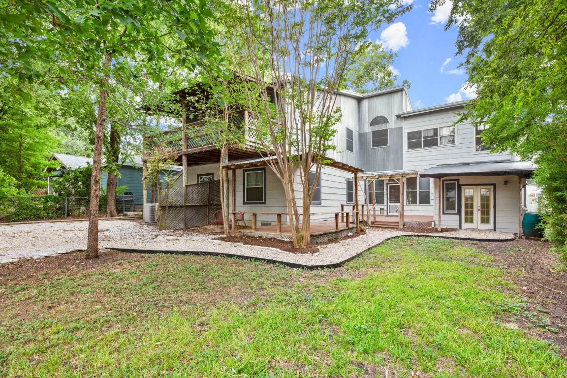 1707 Alguno Road, Unit C Austin, TX 78757 - Photo 4 of 16 Rear view of property with french doors, a wooden deck, and a patio area