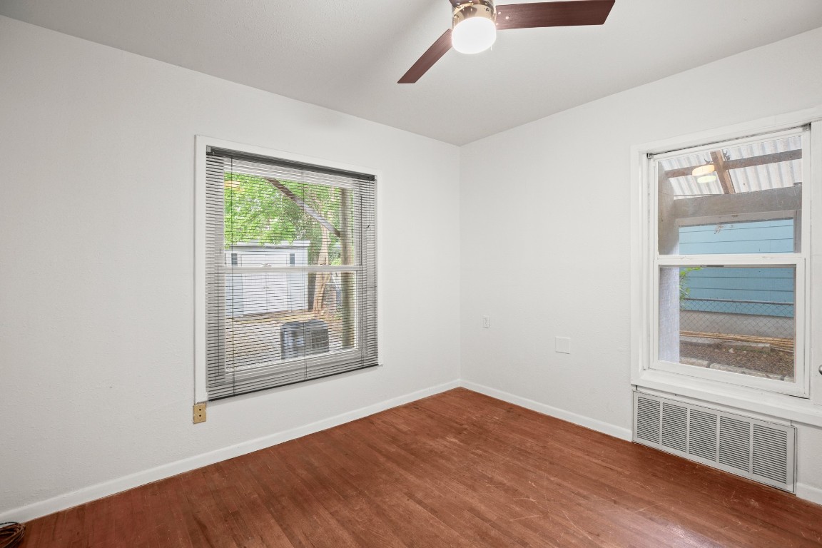 1707 Alguno Road, Unit C Austin, TX 78757 - Photo 6 of 16 with dark wood-style floors and a ceiling fan