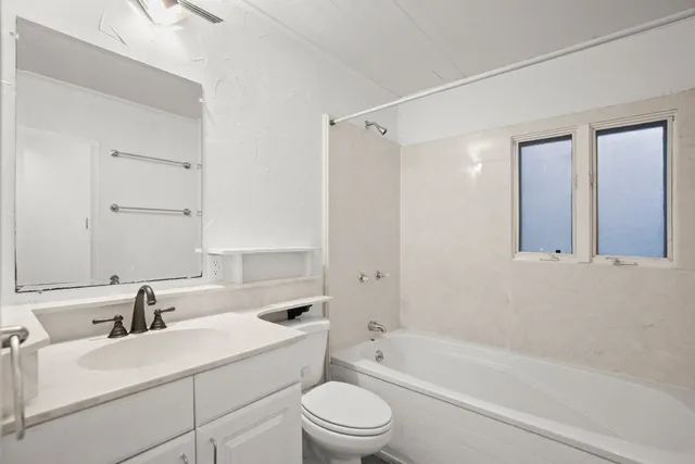a bathroom with a sink a toilet and a bathtub