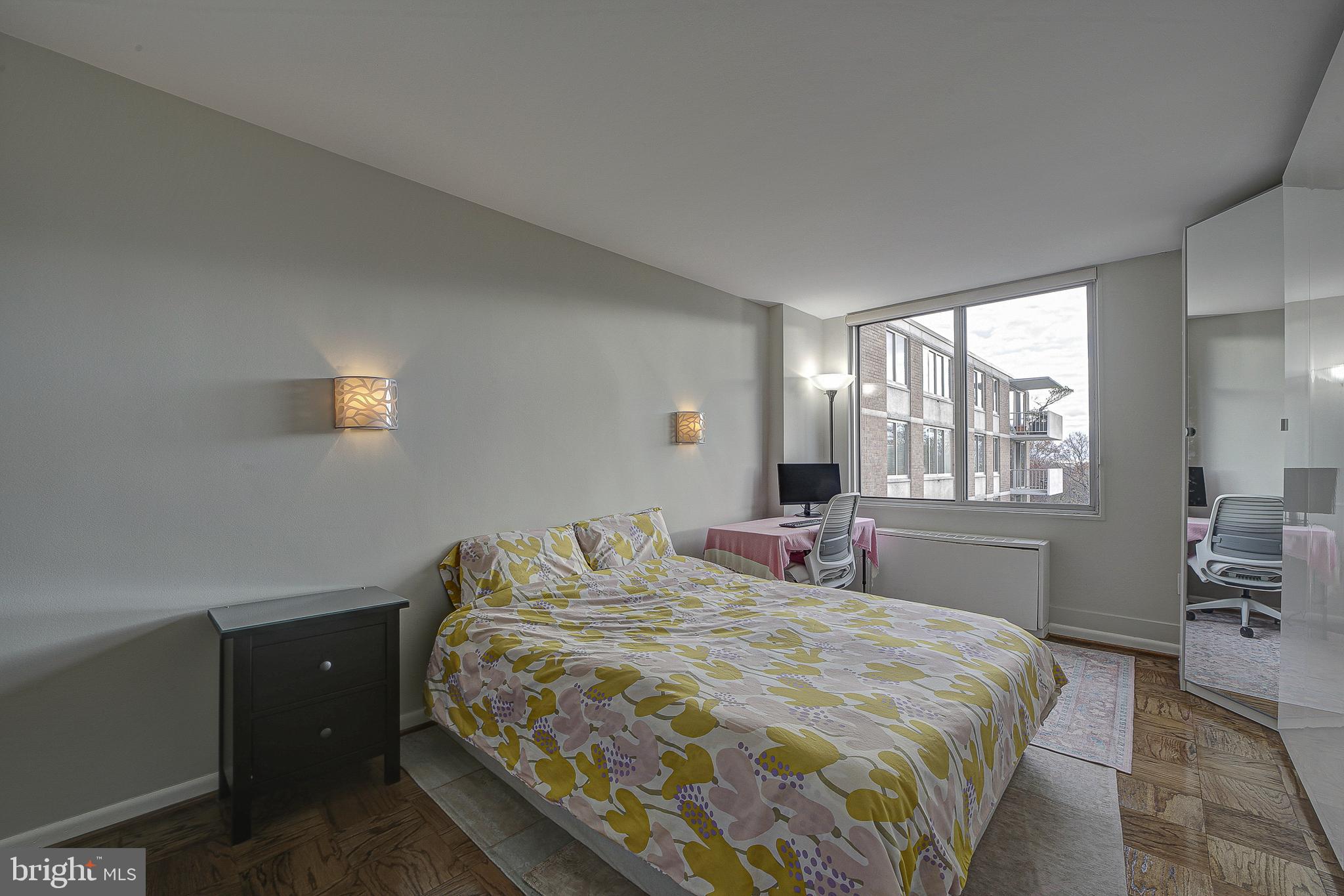 2939 Van Ness Street Northwest, Unit 1126 Washington, DC 20008 - Photo 13 of 31 a bedroom with a bed and window