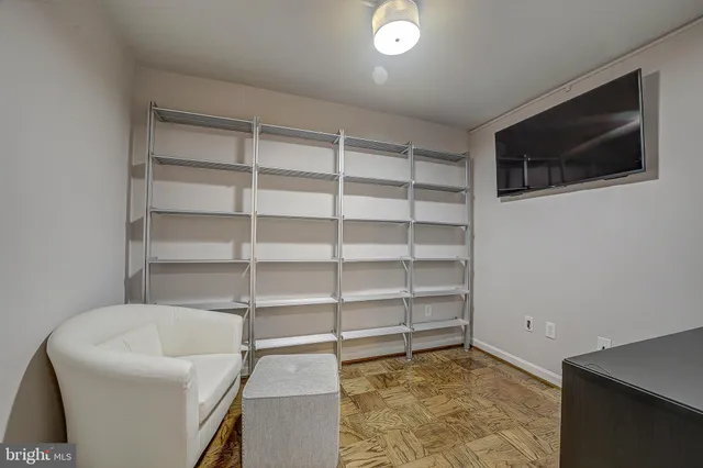 a view of a livingroom with shelves