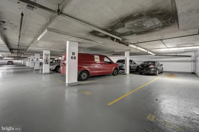 a view of parking garage with cars