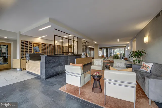 a living room with furniture a dining table and chairs