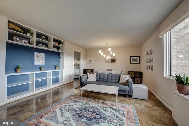a living room with furniture and a rug