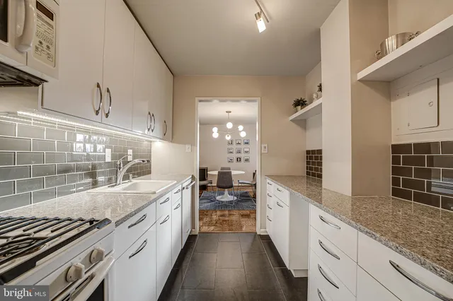 a large kitchen with a lot of counter space and a sink