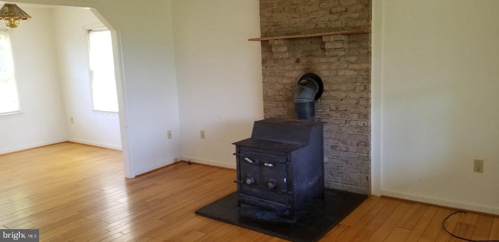 80 Rudasill Mill Road Woodville, VA 22749 - Photo 5 of 27 Living & FP. New$8k Heat system installed.
