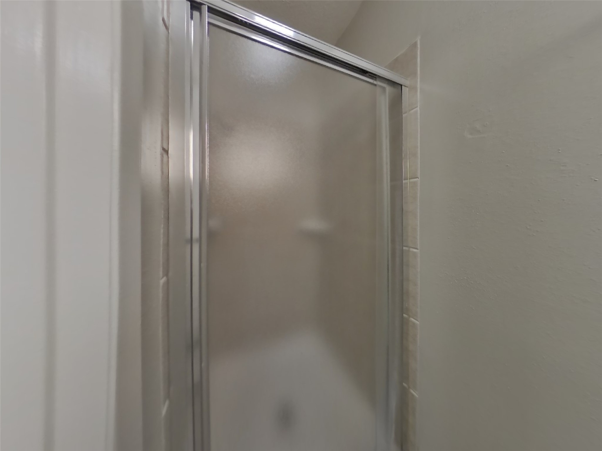 4511 Burkegate Drive Spring, TX 77373 - Photo 12 of 20 a bathroom with a glass shower door