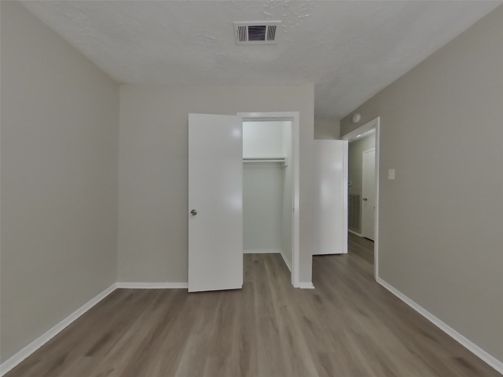 4511 Burkegate Drive Spring, TX 77373 - Photo 13 of 20 an empty room with wooden floor