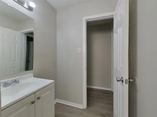a bathroom with a sink and mirror