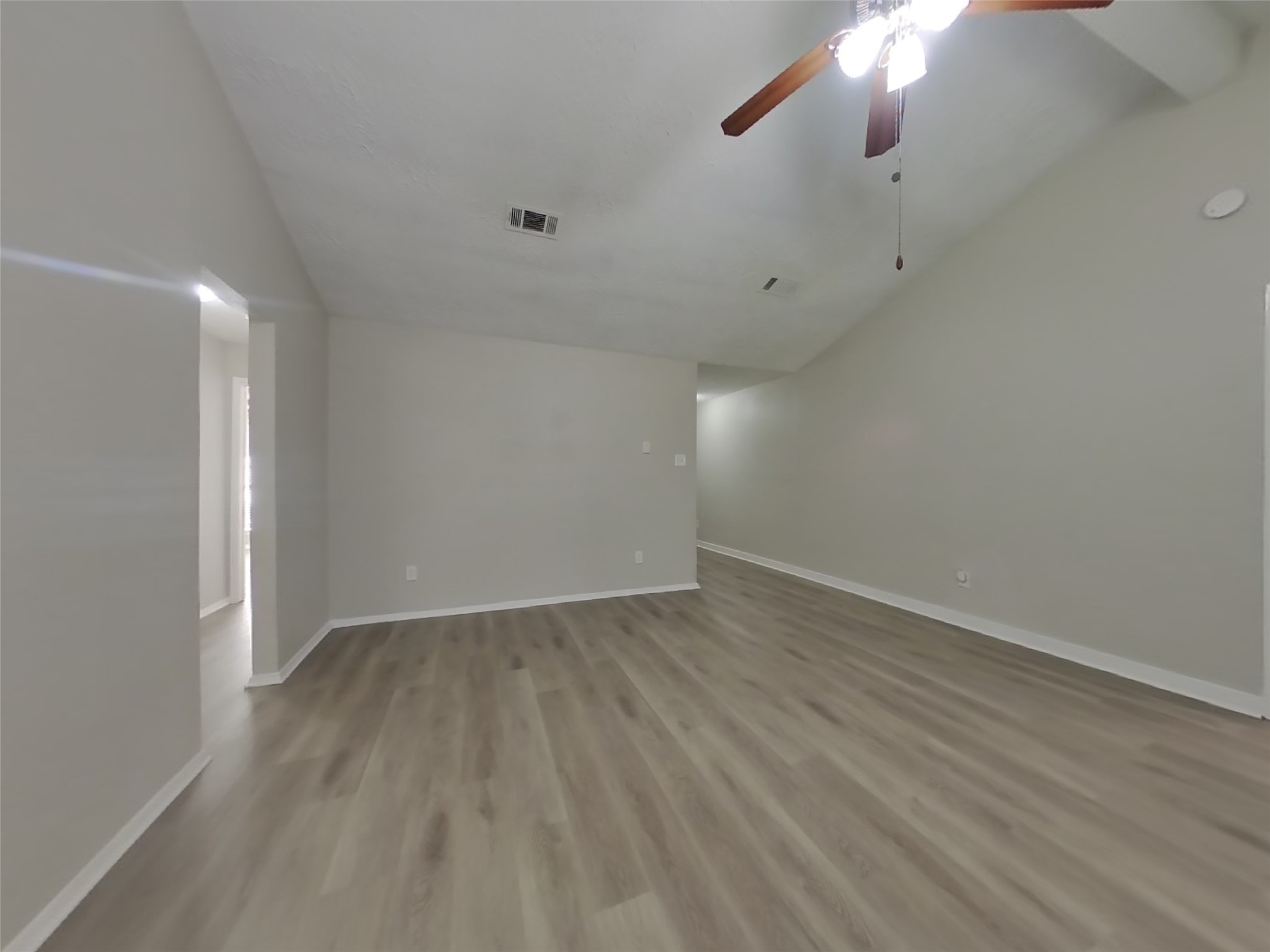 4511 Burkegate Drive Spring, TX 77373 - Photo 2 of 20 an empty room with wooden floor and windows