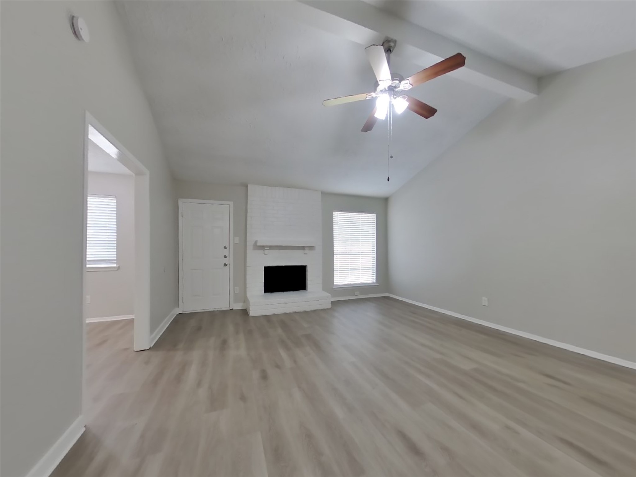 4511 Burkegate Drive Spring, TX 77373 - Photo 3 of 20 wooden floor in an empty room with a fireplace