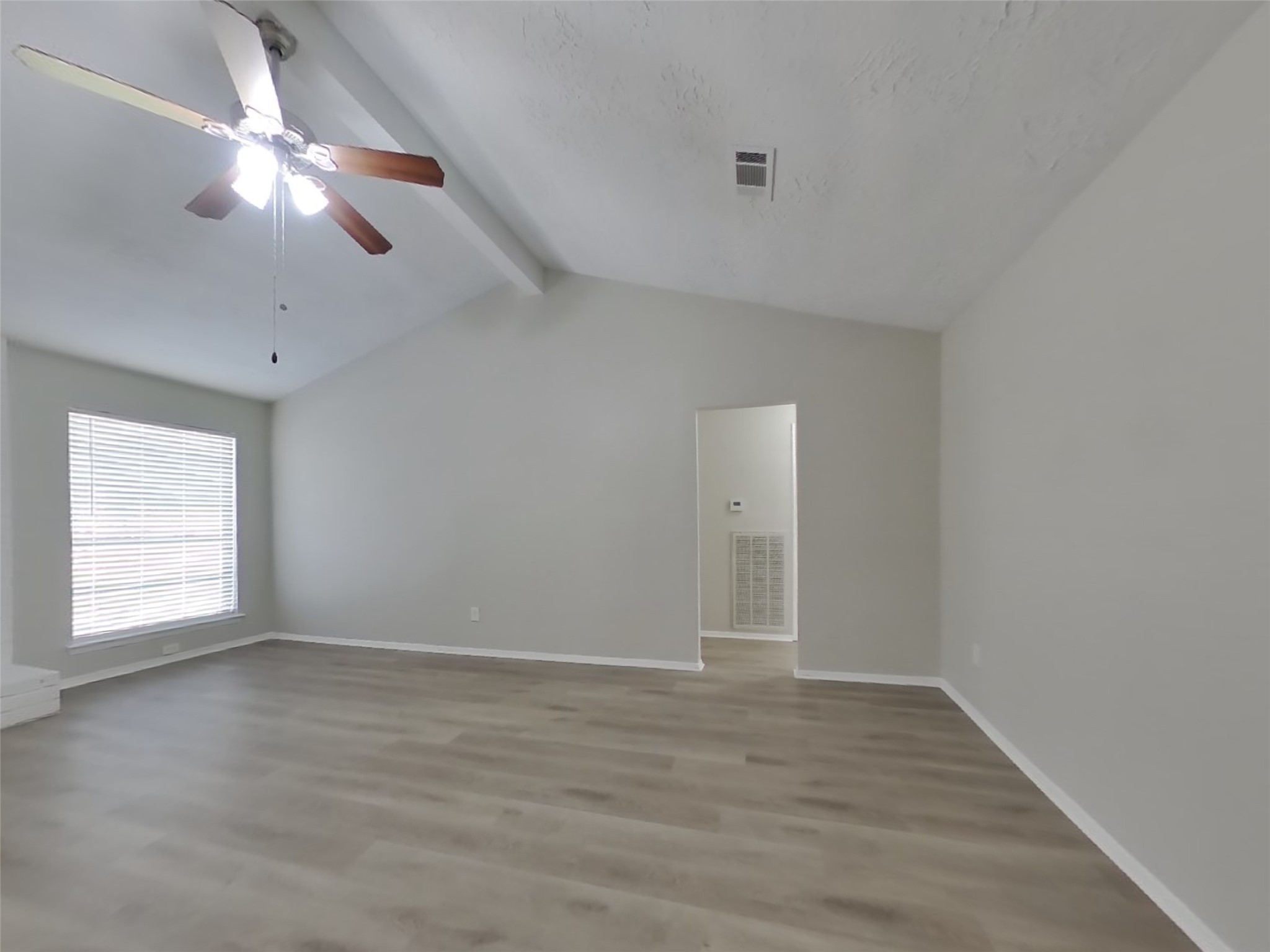 4511 Burkegate Drive Spring, TX 77373 - Photo 4 of 20 an empty room with wooden floor and windows