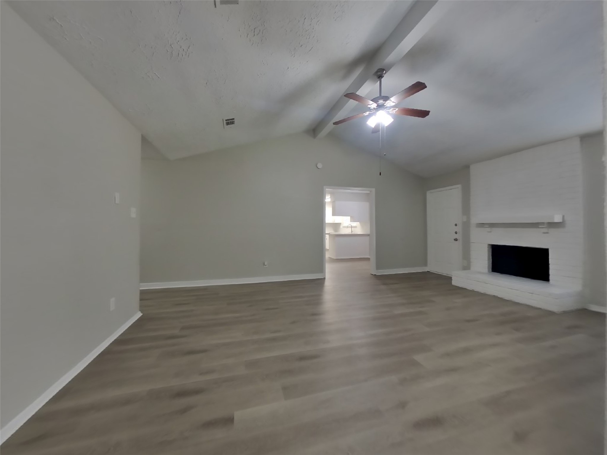 4511 Burkegate Drive Spring, TX 77373 - Photo 5 of 20 wooden floor in an empty room with a fireplace