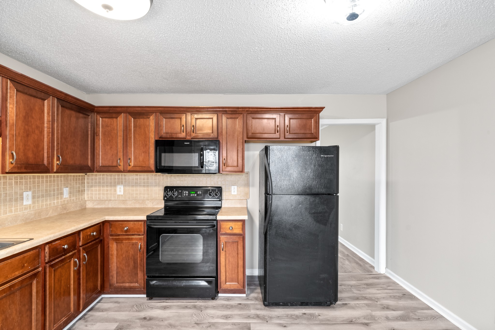 103 Meridians Way Oak Grove, KY 42262 - Photo 13 of 32 a kitchen with granite countertop a refrigerator stove and oven